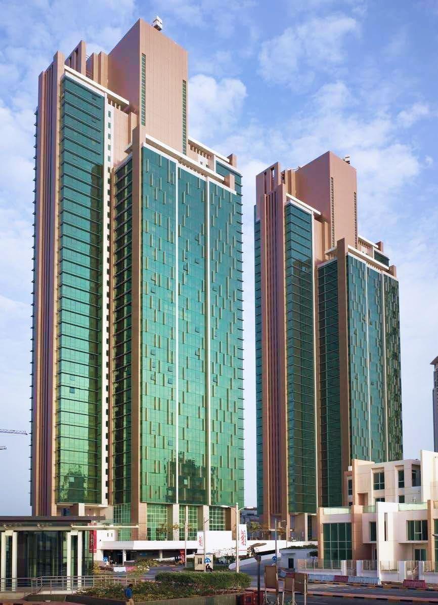 Al Durrah Tower Marina Square street-level exterior highlighting premium location near retail and marina walkways.